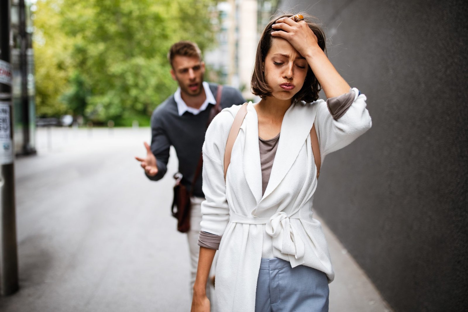 Frustrated couple arguing and having marriage problems outdoor
