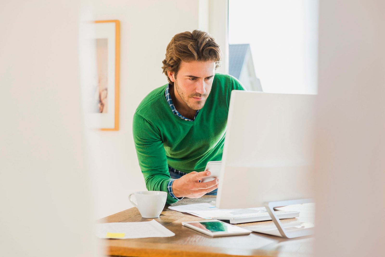 Young man working at home office
