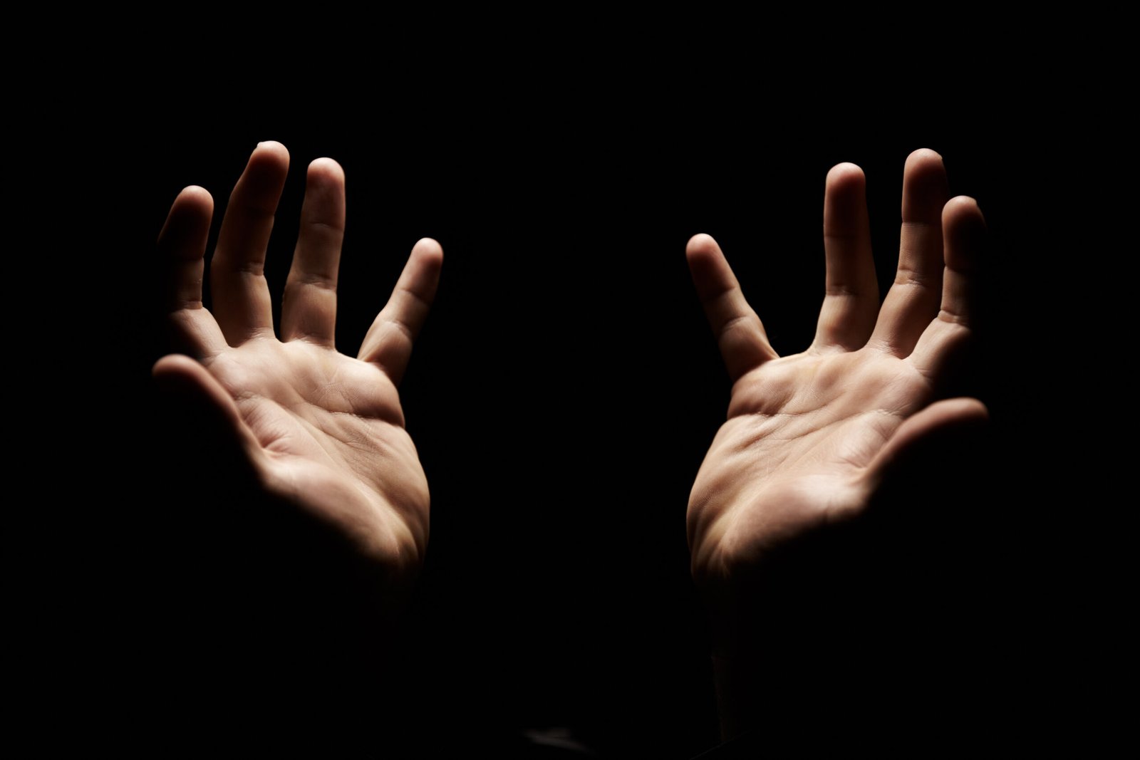 Praising and thanking God. Hands open in praise towards God