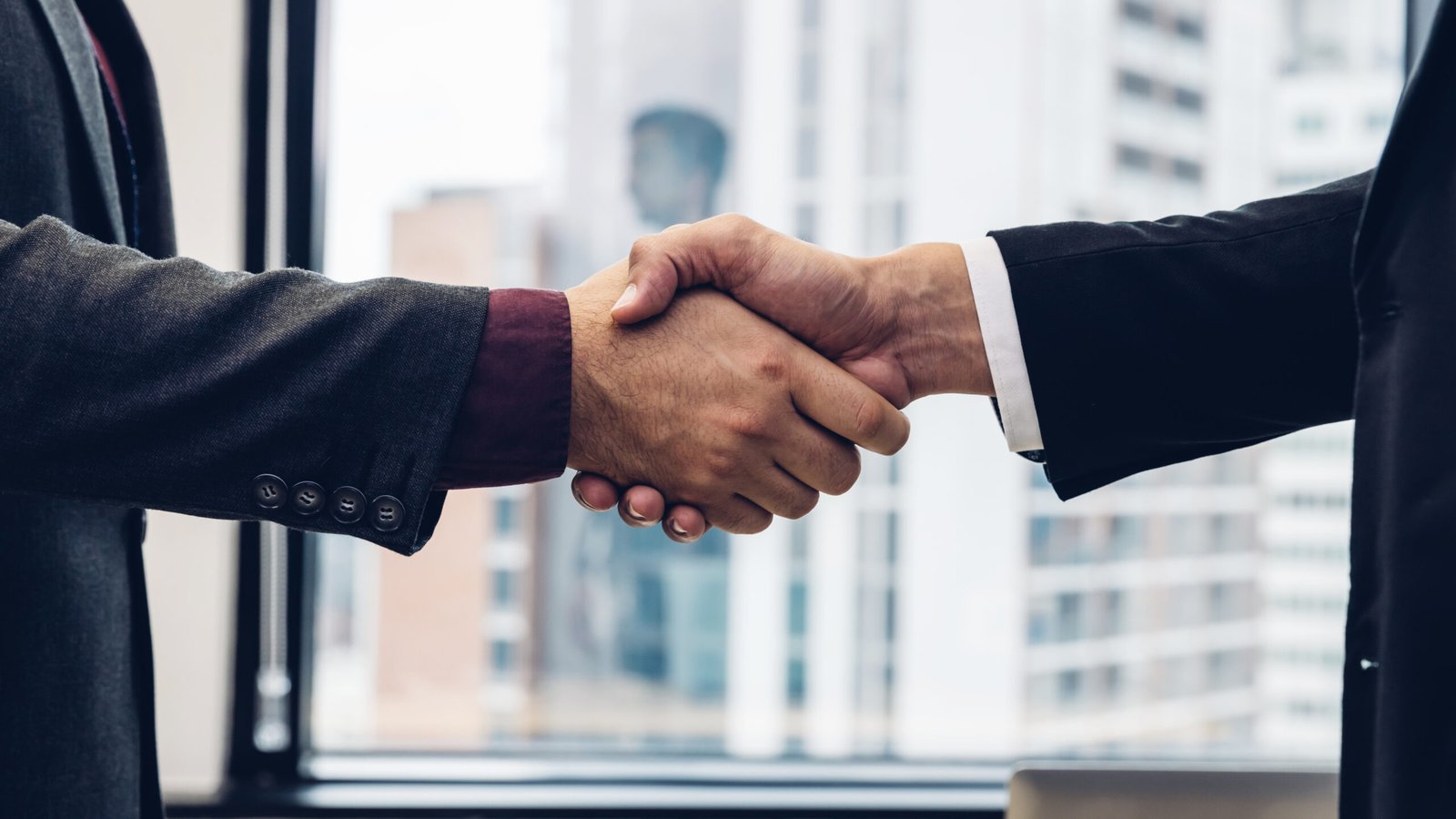Business people shaking hands. Businessman shaking hands during a meeting in the office